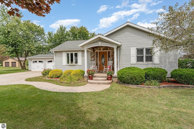 view of front facade with a garage, a front yard, and covered porch