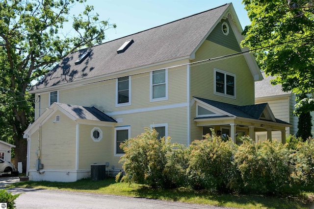 view of side of property with central AC unit