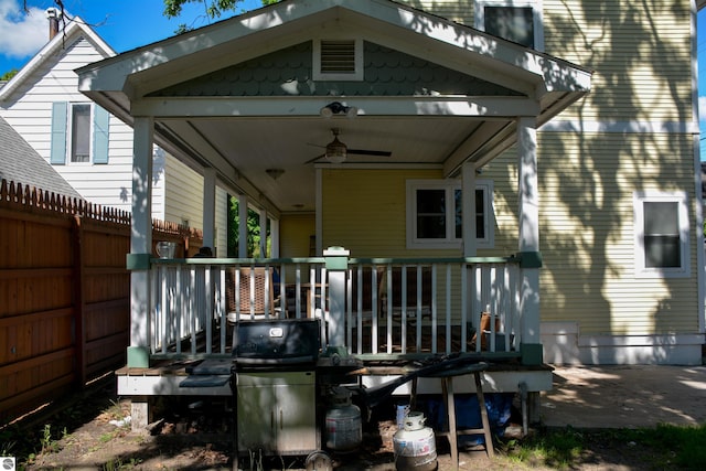 rear view of house featuring ceiling fan