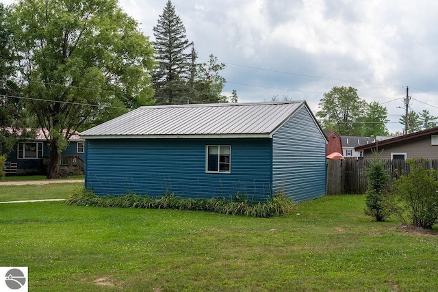 view of side of property with a lawn