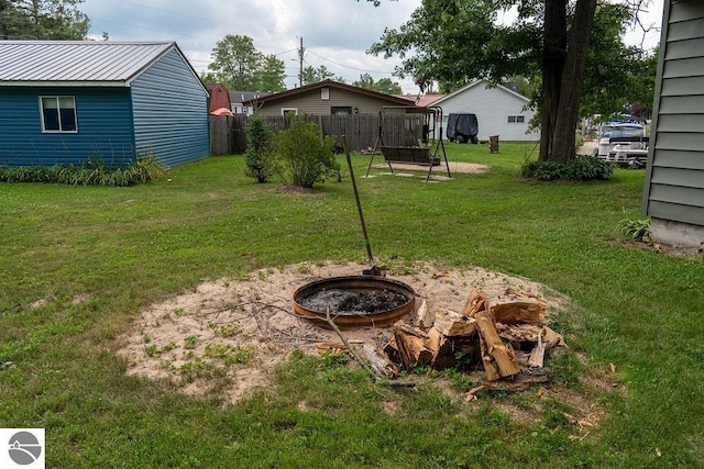 view of yard with a fire pit