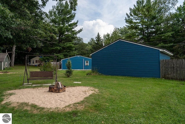 view of yard featuring a fire pit