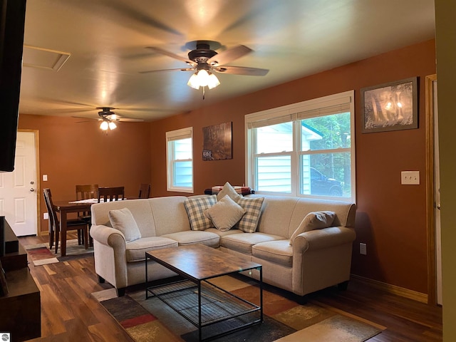 living room with dark hardwood / wood-style floors and ceiling fan