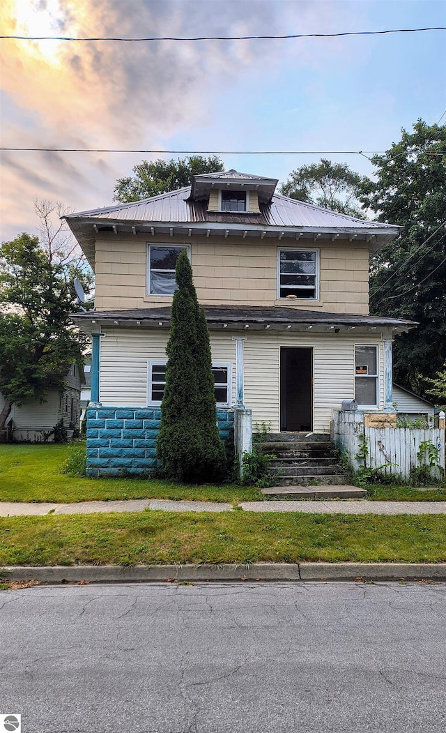 view of front of home with a yard