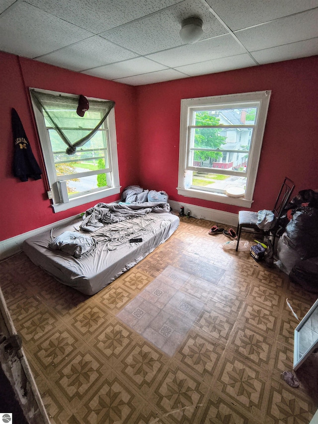 bedroom featuring a drop ceiling