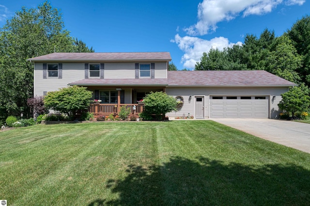 view of property with a garage, covered porch, and a front yard