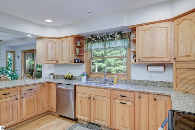 kitchen featuring sink, light stone countertops, dishwasher, and light brown cabinets