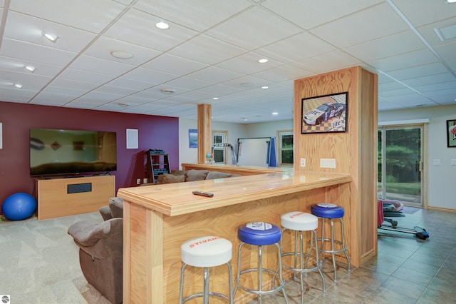 bar featuring a paneled ceiling