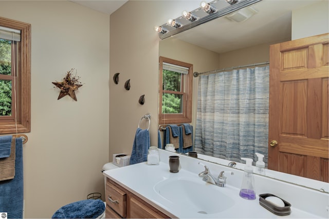 bathroom with vanity and curtained shower