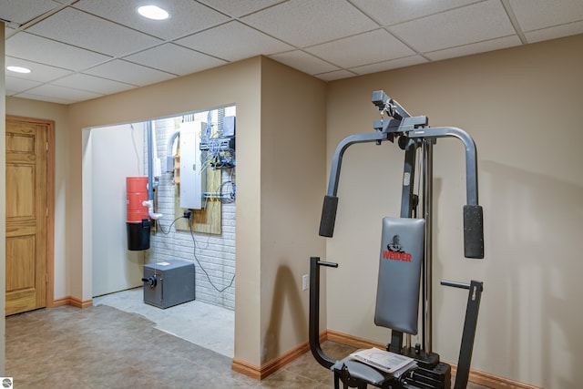 exercise area featuring a drop ceiling