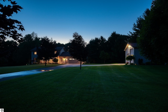 view of yard at dusk