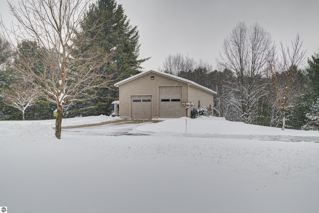 view of snow covered garage