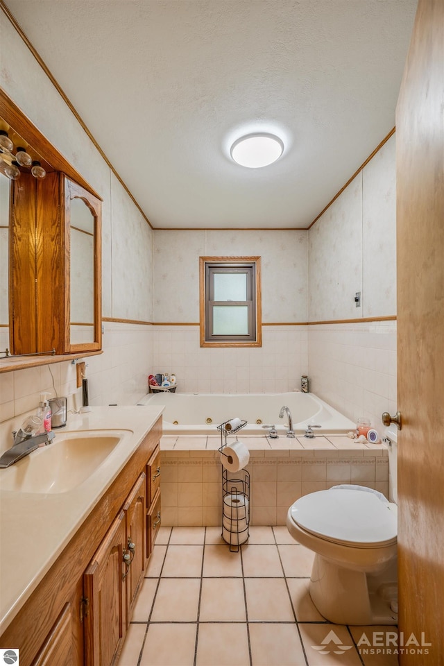 bathroom featuring crown molding, toilet, vanity, tile patterned flooring, and a jetted tub