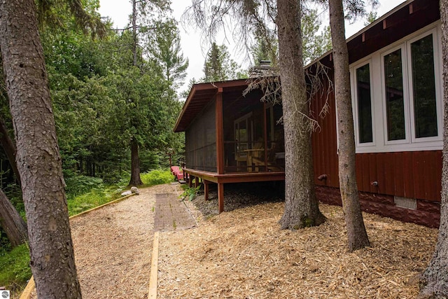 exterior space featuring a sunroom