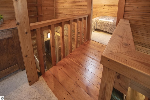 stairway with wooden walls and a sauna