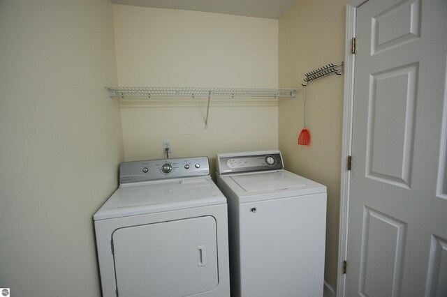 laundry area with washing machine and dryer