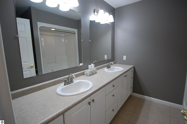 bathroom featuring dual vanity and tile patterned flooring