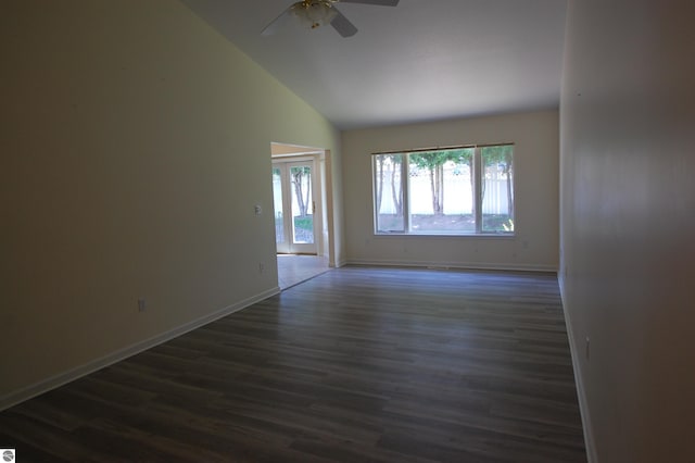 empty room with a ceiling fan, baseboards, dark wood-style flooring, and high vaulted ceiling