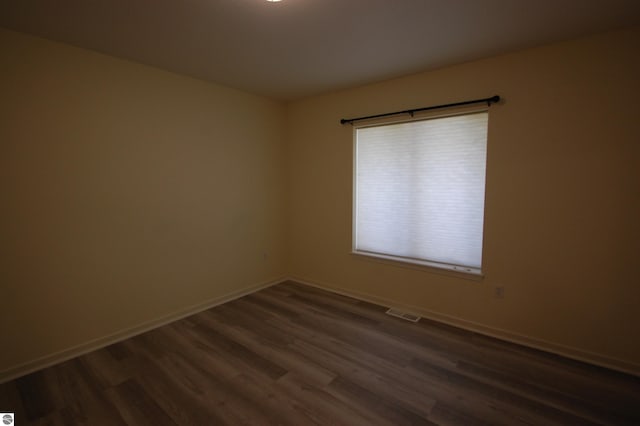 empty room featuring hardwood / wood-style floors