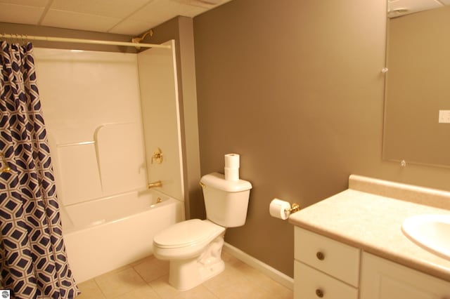 full bathroom with toilet, shower / bath combo, tile patterned flooring, a drop ceiling, and vanity