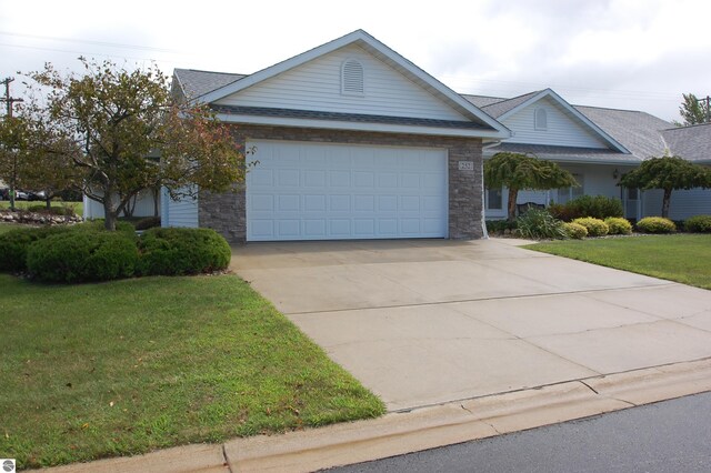 ranch-style house with a front lawn and a garage