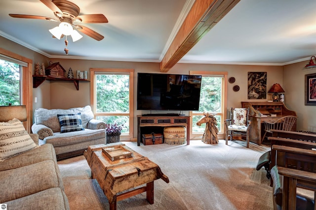 living room with crown molding, a healthy amount of sunlight, light colored carpet, and ceiling fan