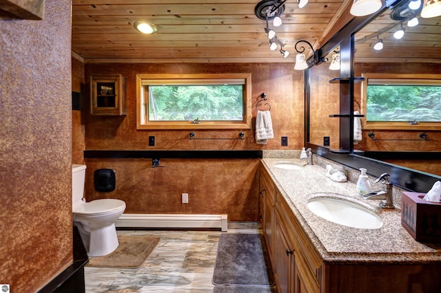 bathroom with wood ceiling, a baseboard radiator, and a wealth of natural light