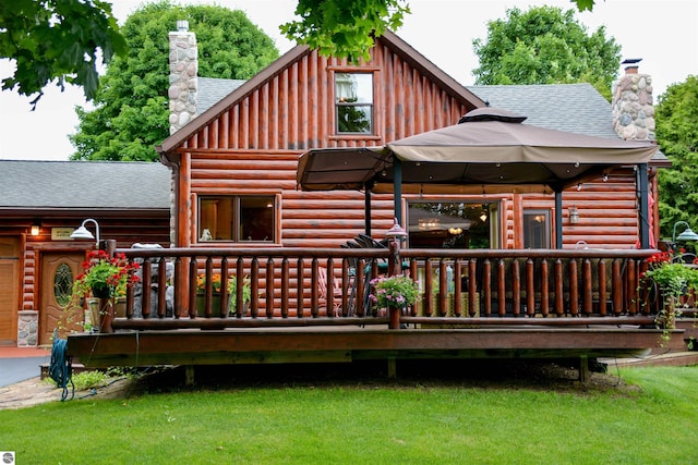 rear view of property with a gazebo