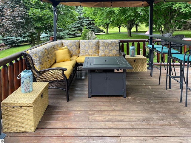 wooden deck with an outdoor living space