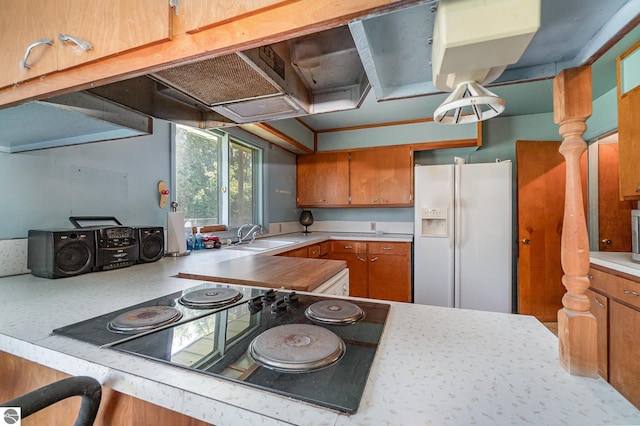 kitchen featuring sink, white fridge with ice dispenser, and black electric cooktop