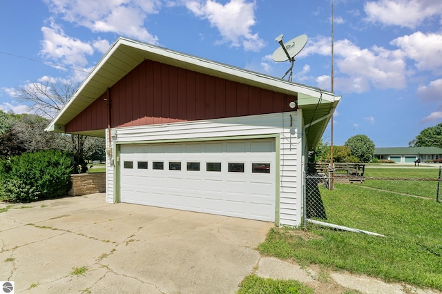 garage featuring a lawn