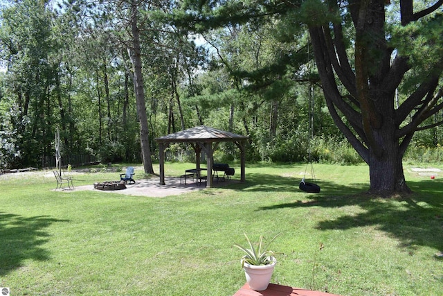 view of yard with a patio, a fire pit, and a gazebo