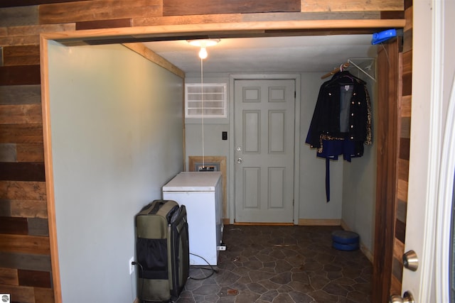 laundry area featuring washer and clothes dryer and tile patterned flooring