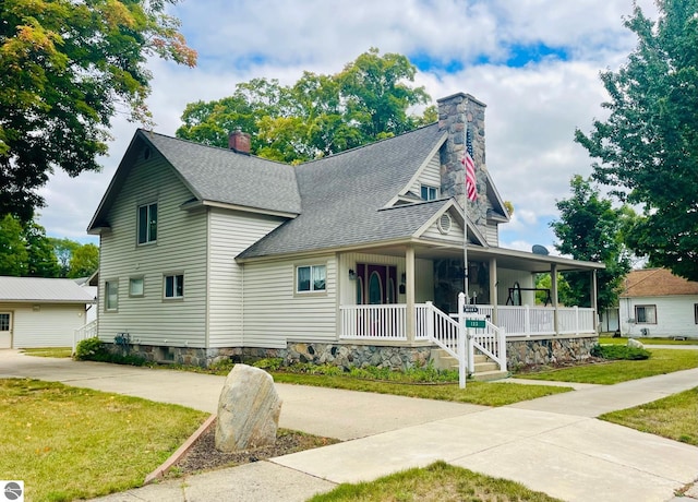 view of front of home with a front lawn and a porch