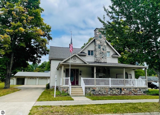 view of front of house featuring a porch and a garage