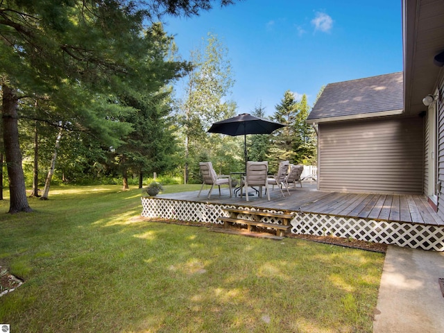 view of yard featuring a wooden deck