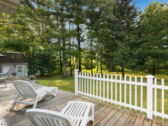 wooden deck with a lawn