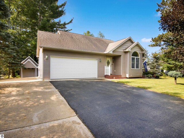 view of front facade featuring a front lawn and a garage