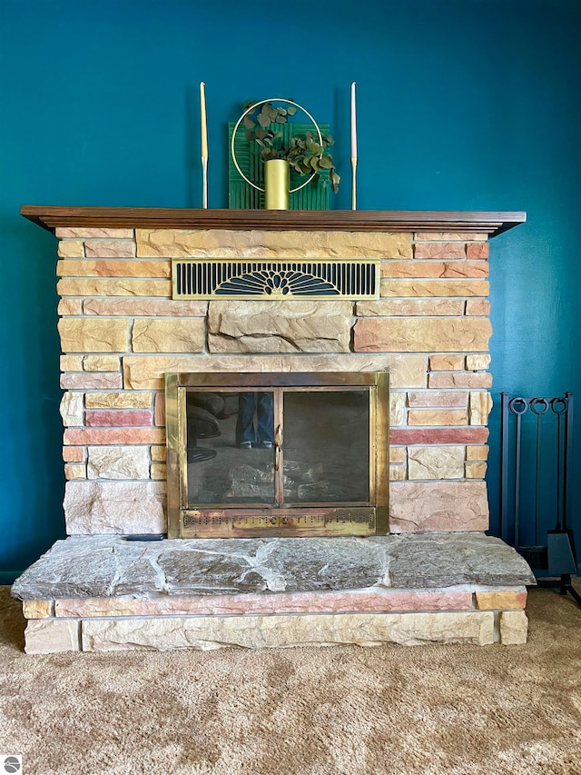 interior details featuring carpet flooring and a fireplace