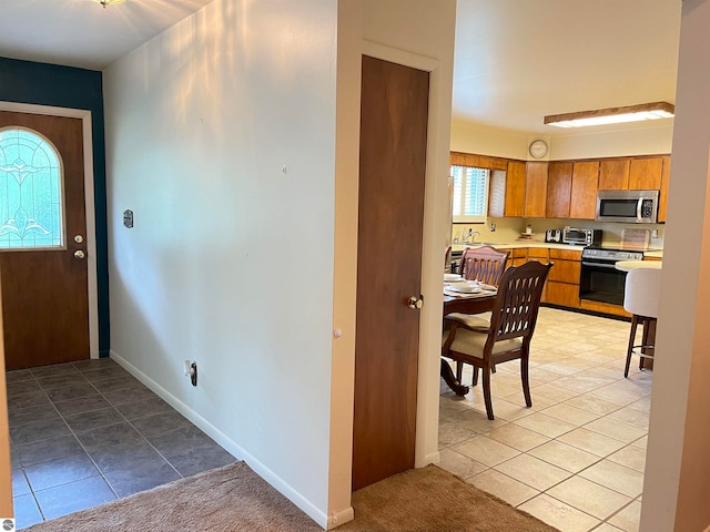 tiled foyer with sink