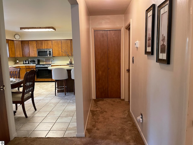 corridor with light colored carpet