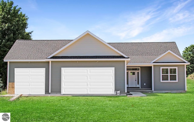 single story home featuring a front yard and a garage