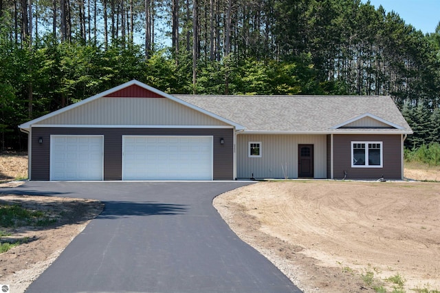 ranch-style home featuring a garage