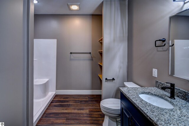 full bathroom with toilet, vanity, and shower / washtub combination