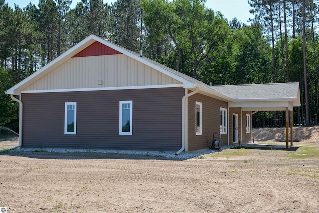 view of front of home featuring a carport