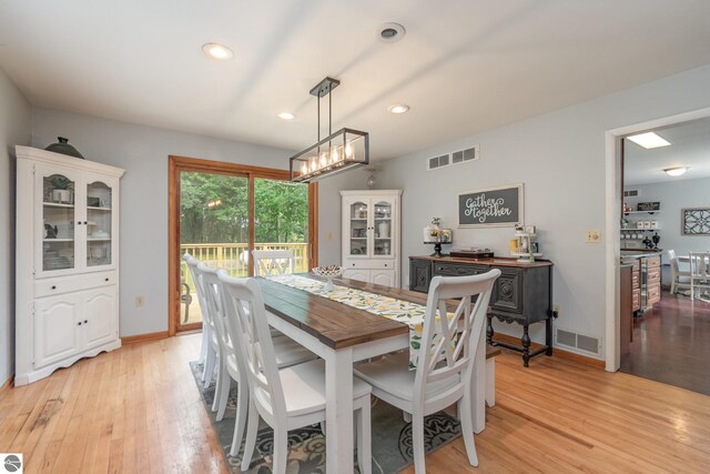 dining area featuring light wood-type flooring