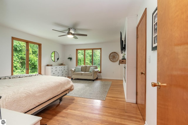 bedroom featuring ceiling fan and light wood-type flooring