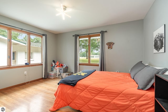 bedroom with light hardwood / wood-style floors