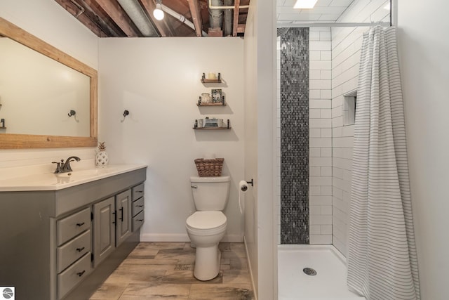 bathroom featuring hardwood / wood-style flooring, a shower with curtain, vanity, and toilet