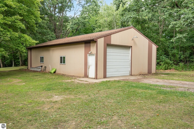 garage featuring a lawn